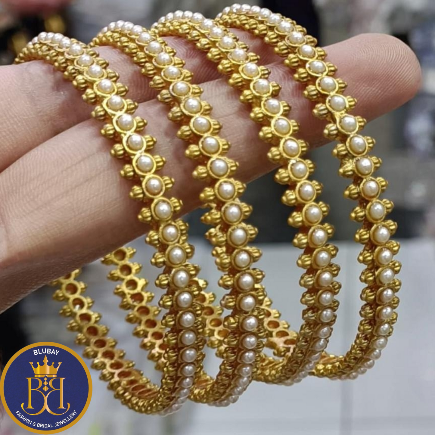 Simple pearls lined antique gold finish bangles set