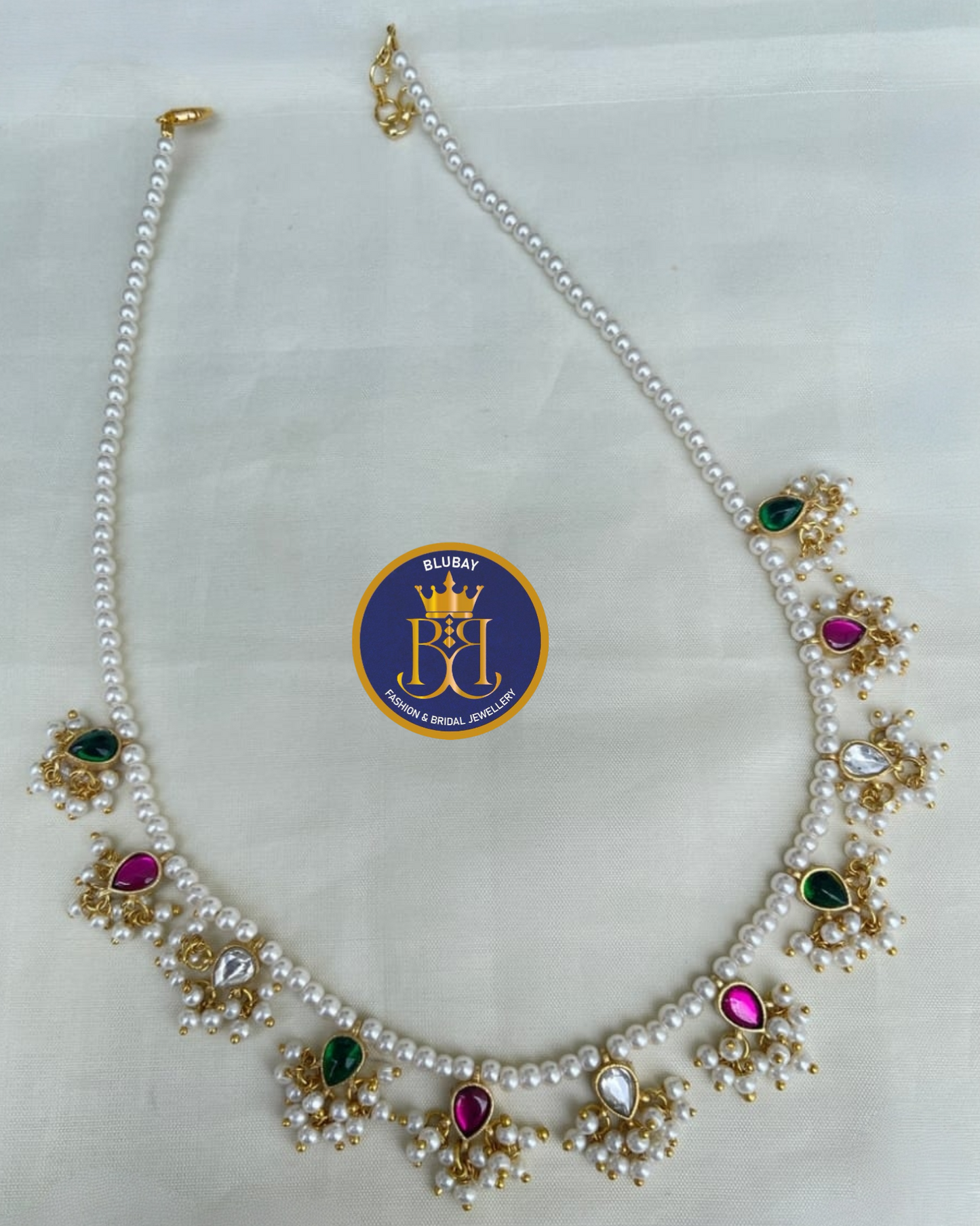 Dazzling designer pearl mala with multicolored jadau stones