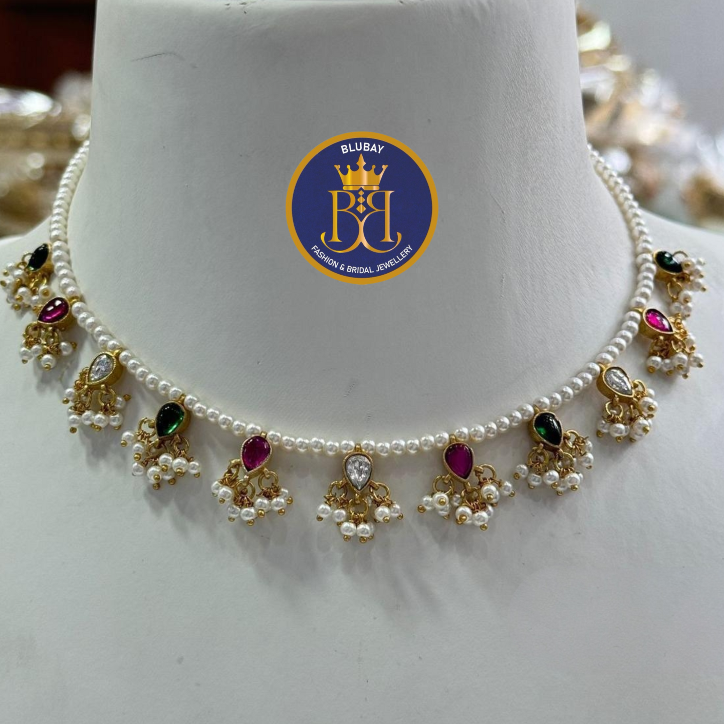 Dazzling designer pearl mala with multicolored jadau stones