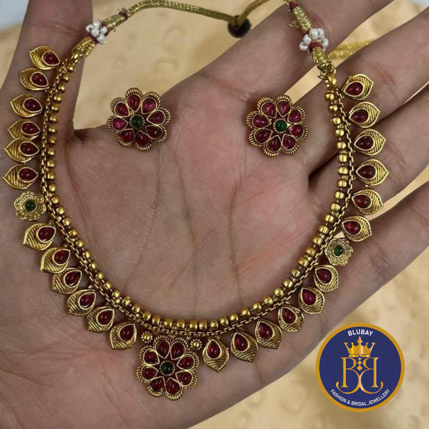 Kemp stone studded floral antique gold Necklace set with Studs