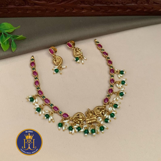 Premium Golden Devi Necklace set with rice pearls and green beads clusters