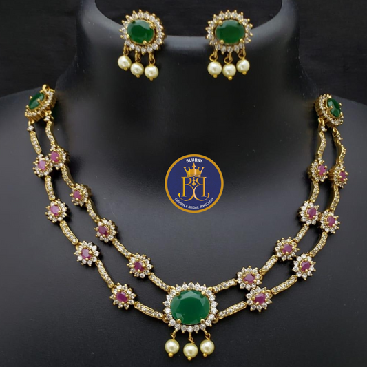 Swasika premium double layered Emerald and Ruby studded AD Necklace set with pearl drops