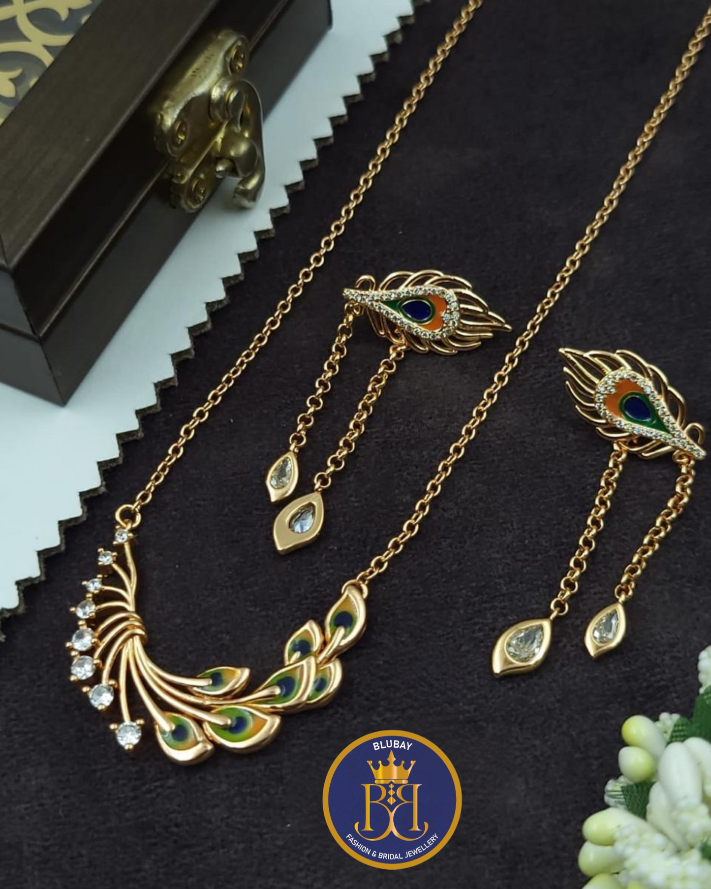 Mayilpeeli peacock designer tasselled rose gold AD pendant chain set