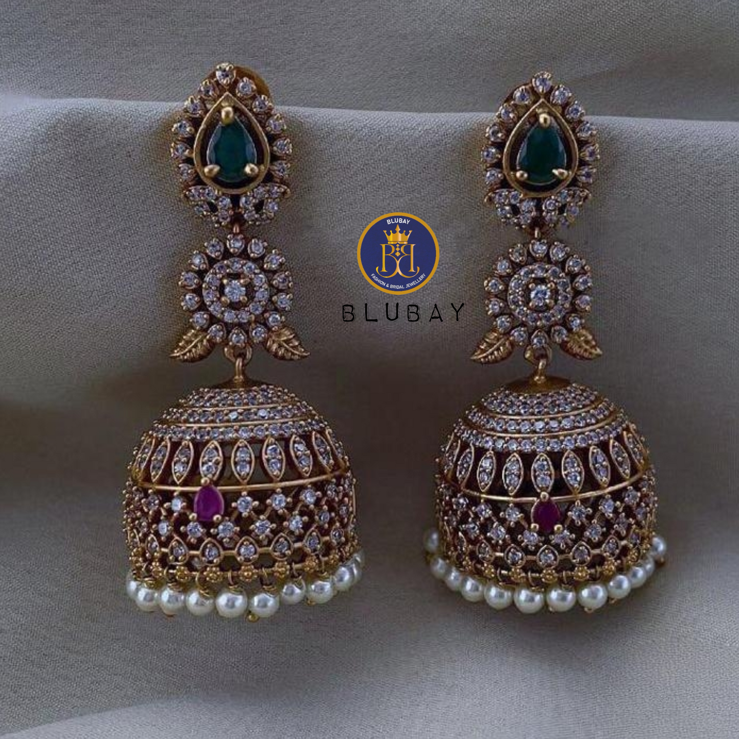 AD extravagant ruby and emerald gold plated premium mango Jhumkas