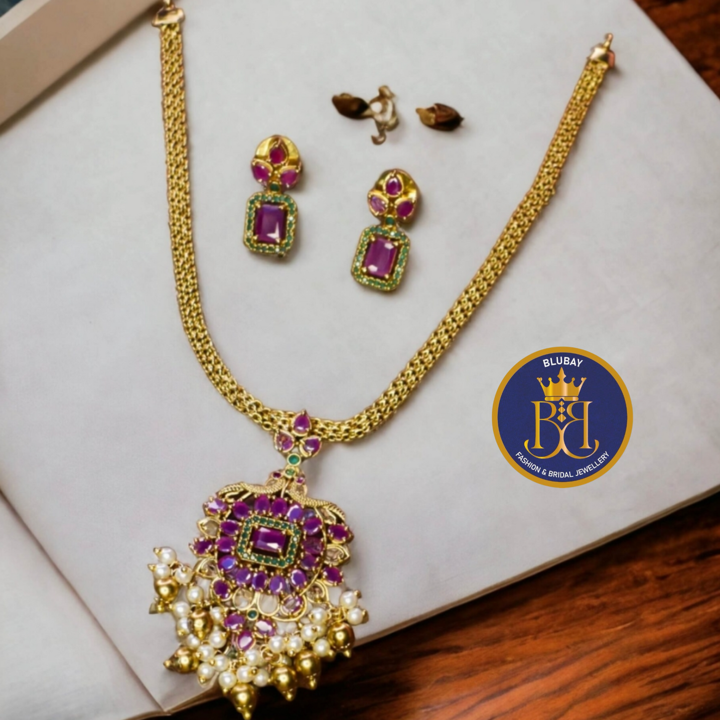 Fuschia premium AD designer pendant golden Choker set with studs